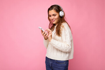 Photo shot of beautiful joyful smiling young female person wearing stylish casual outfit isolated...