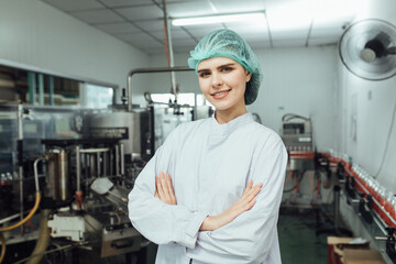 Portrait workers in production line at drinks production factory background