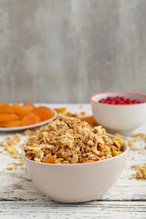 Bowl with tasty granola on table