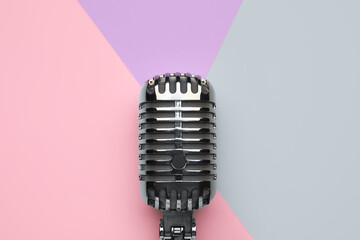 Retro microphone on color background, closeup