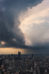 Dramatic raining sky over Bangkok, Thailand.  City Skyline with raining cloud