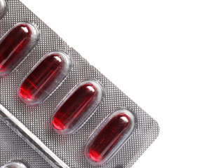 Blister pack with pills on white background