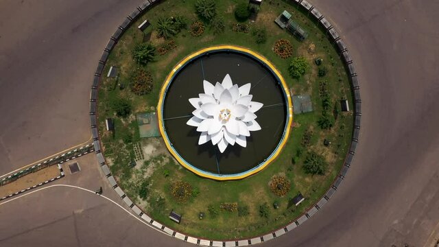 Aerial view of a roundabout with a lily point water fountain during Covid-19 lockdown, empty road in Dhaka, Bangladesh.