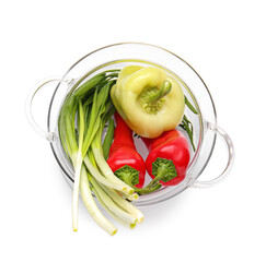 Stylish cooking pot with vegetables on white background