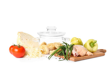 Stylish cooking pot and products on white background