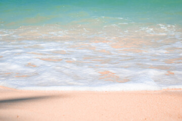 Fototapeta na wymiar Close up beach and white sand captures. Beach waves bubbles