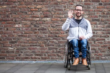 Fototapeta na wymiar man in wheelchair counting on his fingers