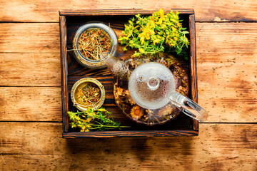 Hypericum in herbal medicine,wooden table