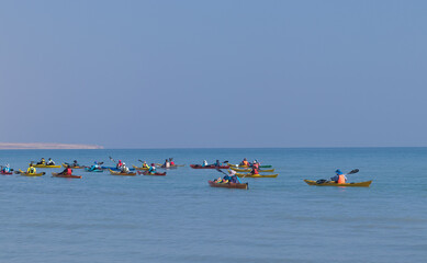ein gedi- israel. 10-02-2021. A group of people rowing for sports in paddle boats in the Dead Sea...
