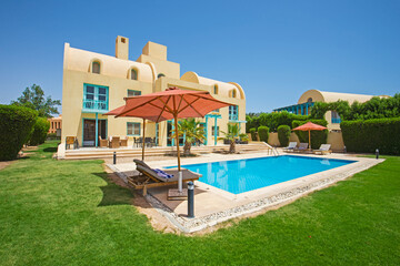 Swimming pool at at luxury tropical holiday villa resort