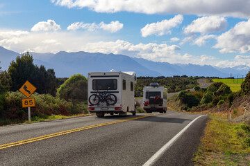 Recreational vehicles on the road between Te Anau and Milford Sound in the South Island of New Zealand