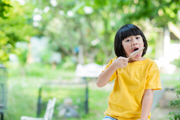 Fototapeta premium kid eating ice cream, delicious and happy concept