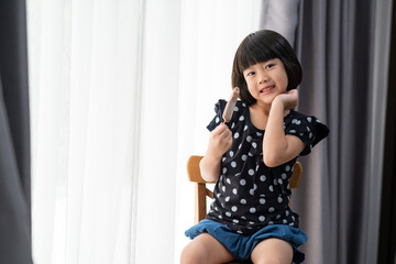 asian girl eating ice cream with blur background