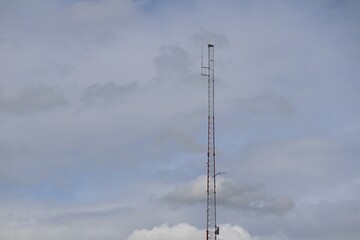 Telecommunication tower with a blue background Sky antenna Radio and satellite Communication technology. Telecommunications industry Mobile network or telecommunications 4g