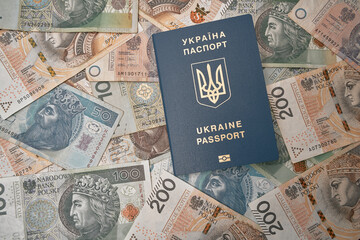 Ukrainian passport and polish zloty flat lay. Concept of working migration. Ukrainian immigration to Poland for better living