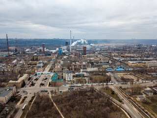 Aerial view from drone of industrial zone with fuming chimneys. Chemical plant