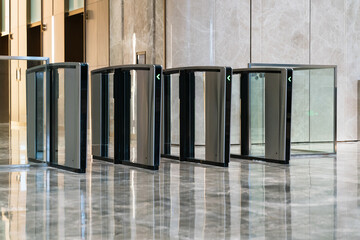 modern turnstile at entrance of office building.