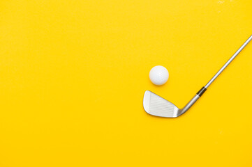 White golf ball and stick on yellow background. Horizontal sport poster, greeting cards, headers, website