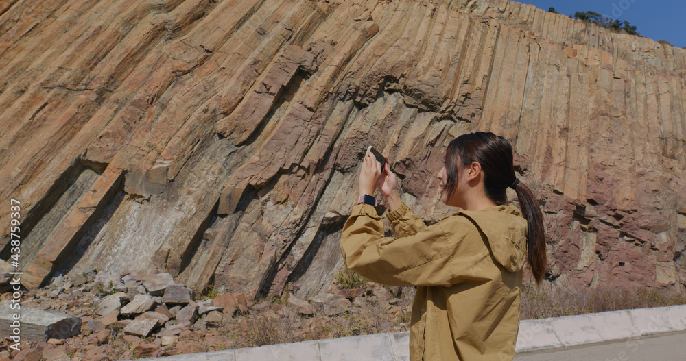 Sticker Woman take photo on cellphone in Geopark