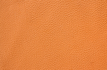 close up of orange leather sheet texture background 