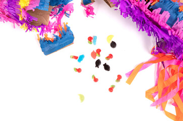 Broken colorful donkey pinata isolated on white