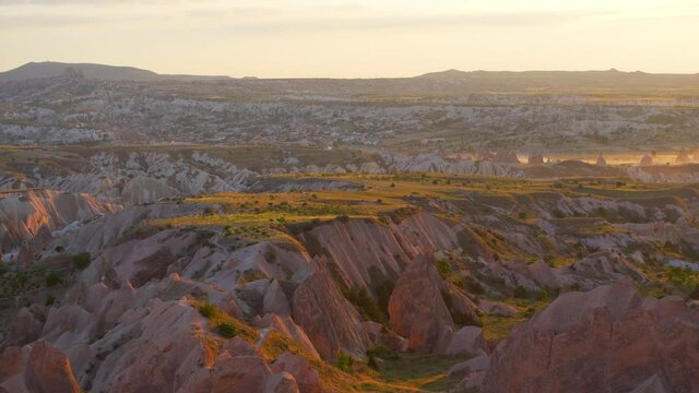 Great amazing sunset aerial view from Aktepe viewpoint high hill. Scenic Red valley in Goreme National Park in Cappadocia region, Central Anatolia, Turkey country. 4k stock video footage