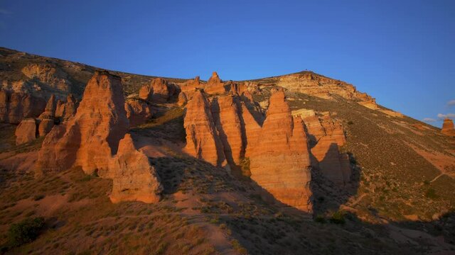Great amazing sunset aerial view from Aktepe viewpoint high hill. Scenic Red valley in Goreme National Park in Cappadocia region, Central Anatolia, Turkey country. 4k stock video footage