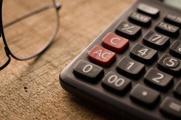 Black calculator on texture background stock image.