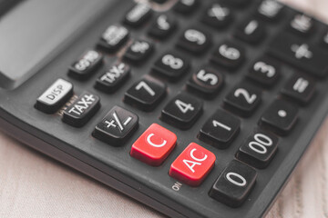 Black calculator on texture background stock image.