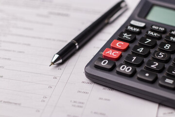 Black calculator on texture background stock image.