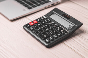 Black calculator on texture background stock image.