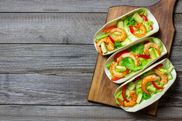 Tacos with shrimp, avocado and salad. Mexican food.