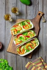 Tacos with shrimp, avocado and salad. Mexican food.