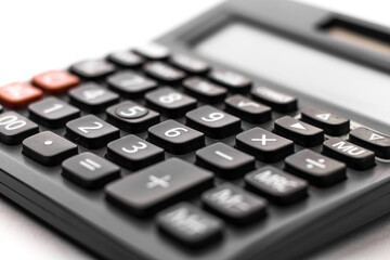 Black calculator on white background isolated stock image.
