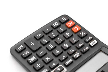 Black calculator on white background isolated stock image.