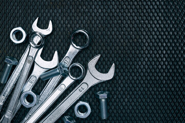 Set of chrome wrenches on steel surface. Mechanic tools for maintenance. Hardware tools to fix