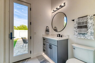 bathroom with a glass door to a patio