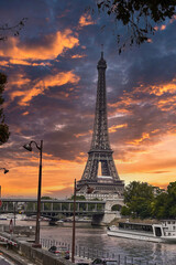 Fototapeta na wymiar Dramatic sunset sky - Beautiful view of the famous Eiffel Tower in Paris, France. The best Paris destinations in Europe.