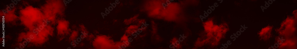 Wall mural red clouds in the black sky. surreal background with copy space for text, design. wide banner. fanta