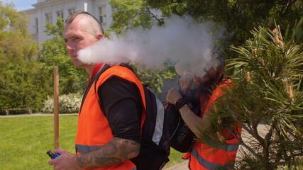 The man smokes a wiper. He inhales, blows smoke out of his mouth. Relaxation of the psyche. Getting...