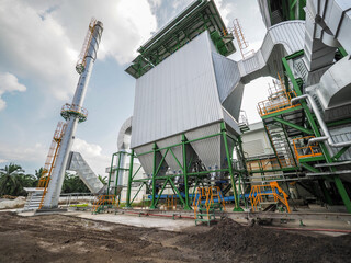 An electrostatic precipitator and stack in biomass power plant. - obrazy, fototapety, plakaty