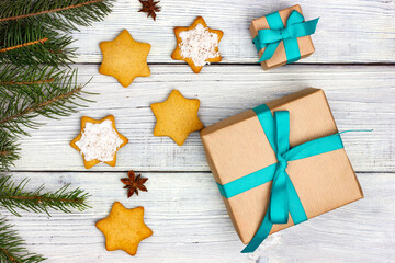 Gift box and Christmas cookies on a light wooden table. Homemade Christmas cookies.