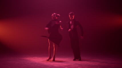 Dance couple bowing after performance on stage. Dancers greeting audience.