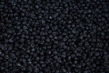 Background prunes. Dried fruits. Top view of prunes as background texture.