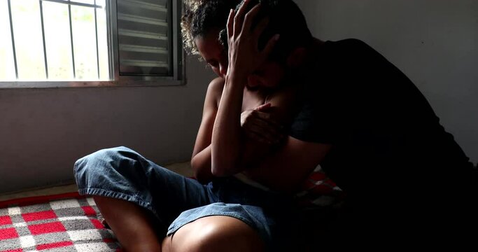 Couple hug during difficult times. Poor family at home feeling despair