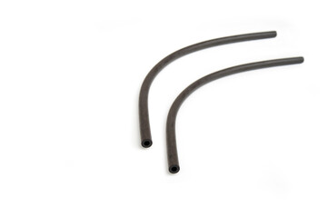 Black rubber fuel hose isolated on white background.