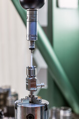 The coordinate measuring machine measures the part