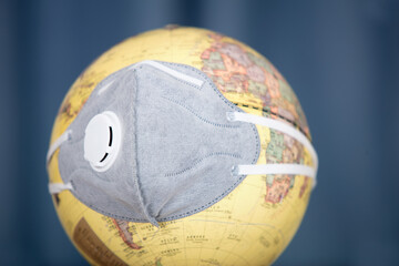 Globe wearing a mask