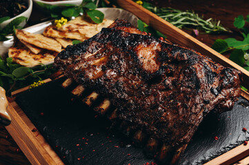Grilled roasted rack of lamb on wooden board