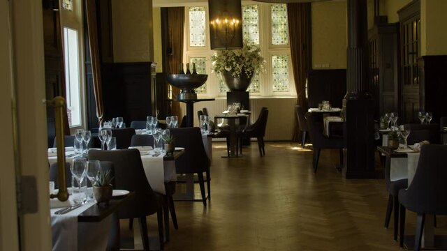 Dolly of empty dining room in luxurious restaurant